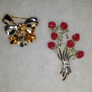 Set of two pins. One bows the other roses.
